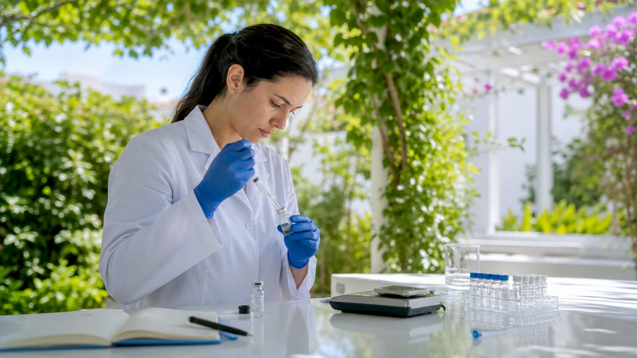 Scientist preparing peptide vial in home lab