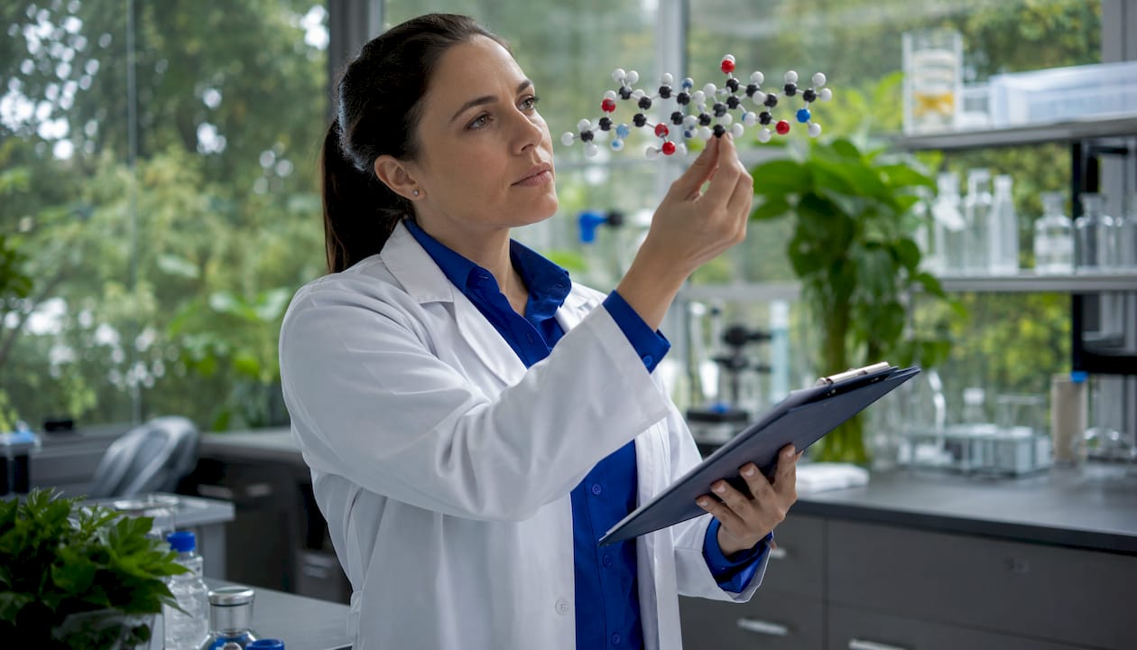 Endocrinologist examining kisspeptin-10 in lab