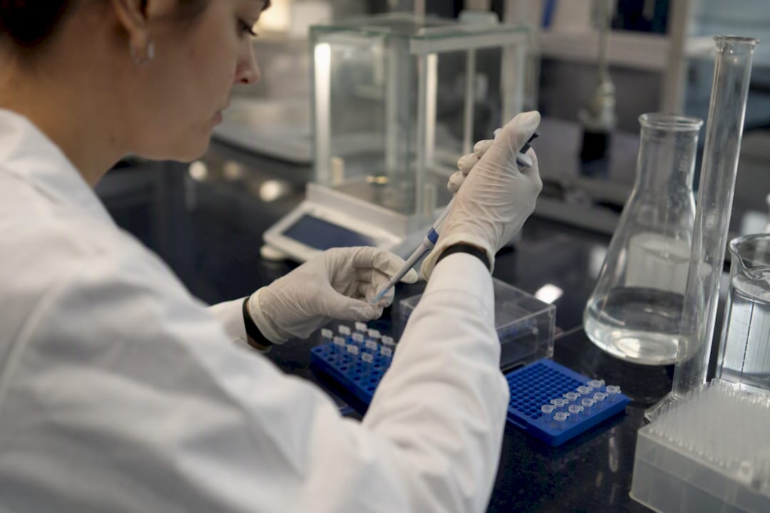 Scientist pipetting DNA samples in lab